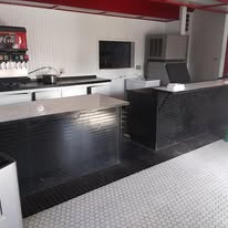 Finished black, white, and red concession counter in a commercial build-out