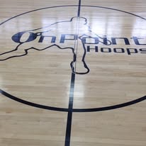 Gym floor coating with a custom OnPoint Hoops logo painted into the court