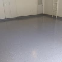 Finished gray speckled epoxy garage floor