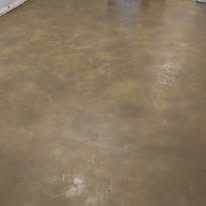 Finished brown and tan mottled decorative stained concrete floor