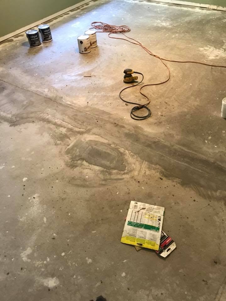Bare concrete floor sanded and prepped for epoxy coating
