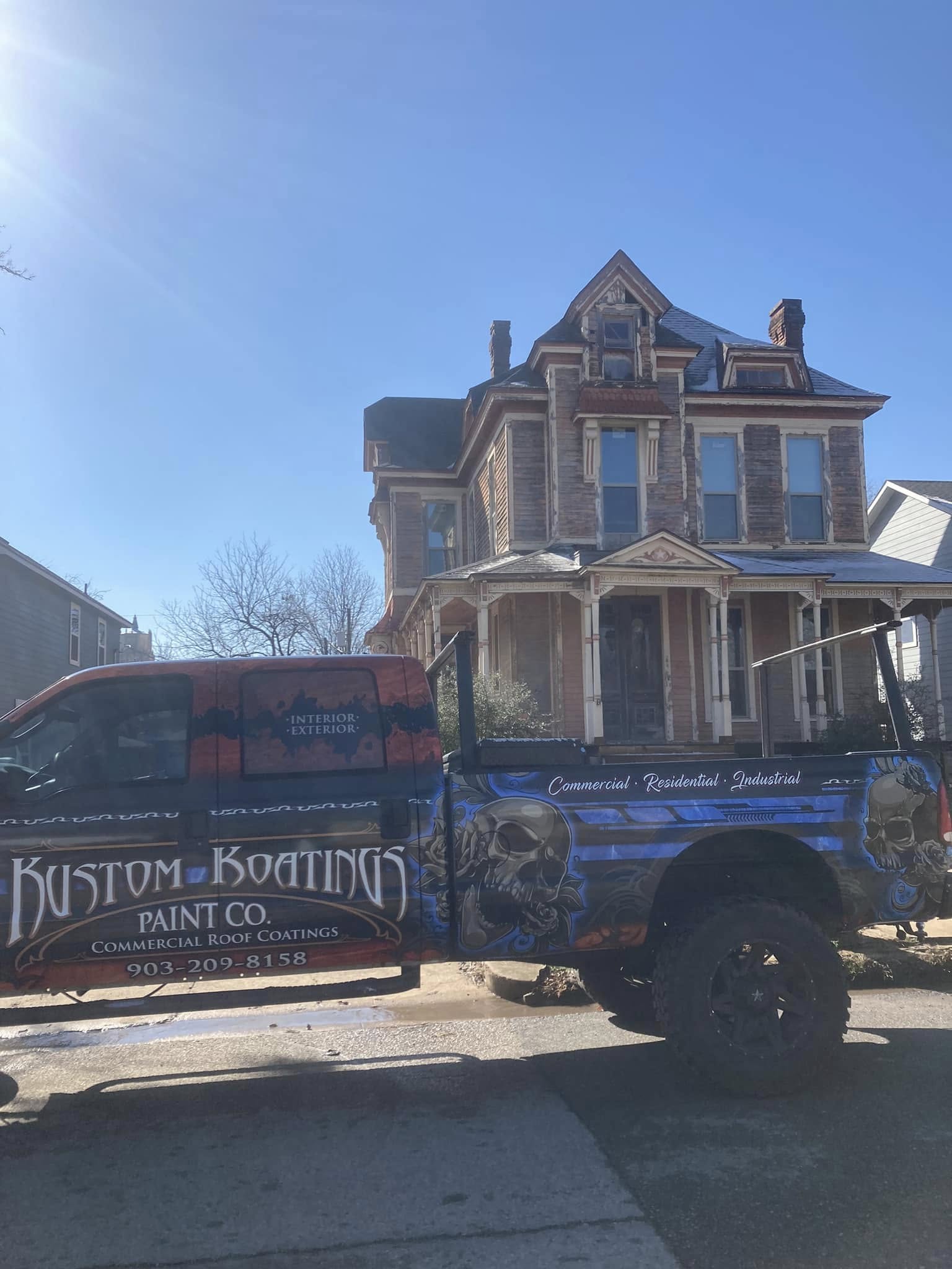 Weathered three-story Victorian house exterior before painting, Kustom Koatings truck parked out front